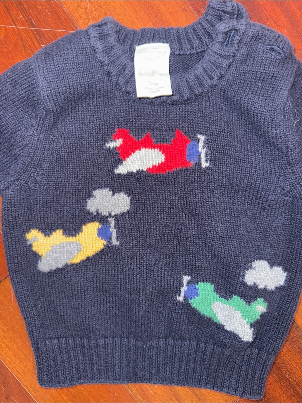 Starting Out Navy Sweater Vest with Red, Yellow & Green Airplanes